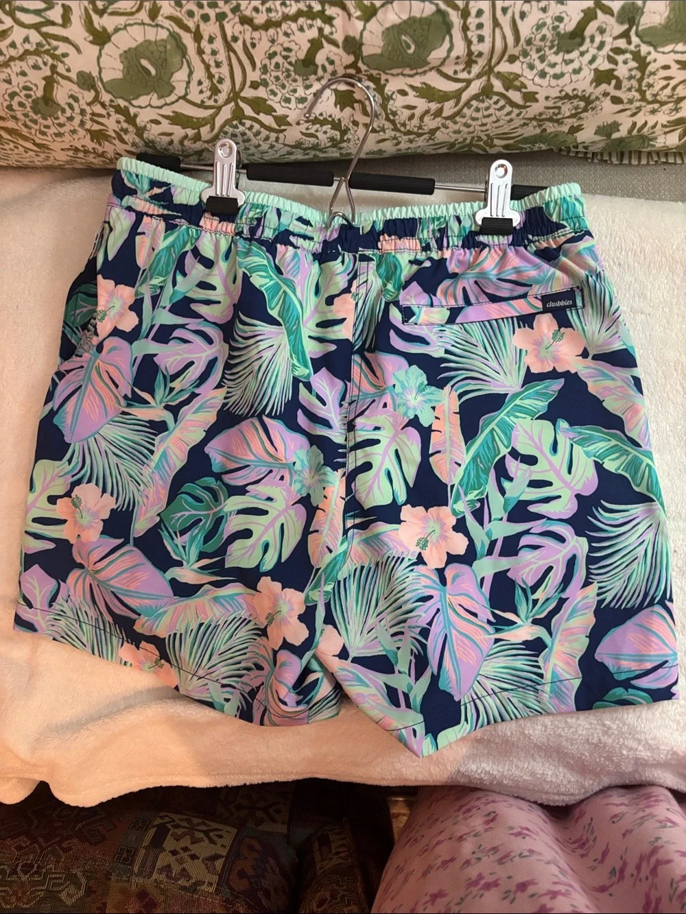 chubbies Navy Tropical Leaf Print Swim Trunks with Pastel Accents